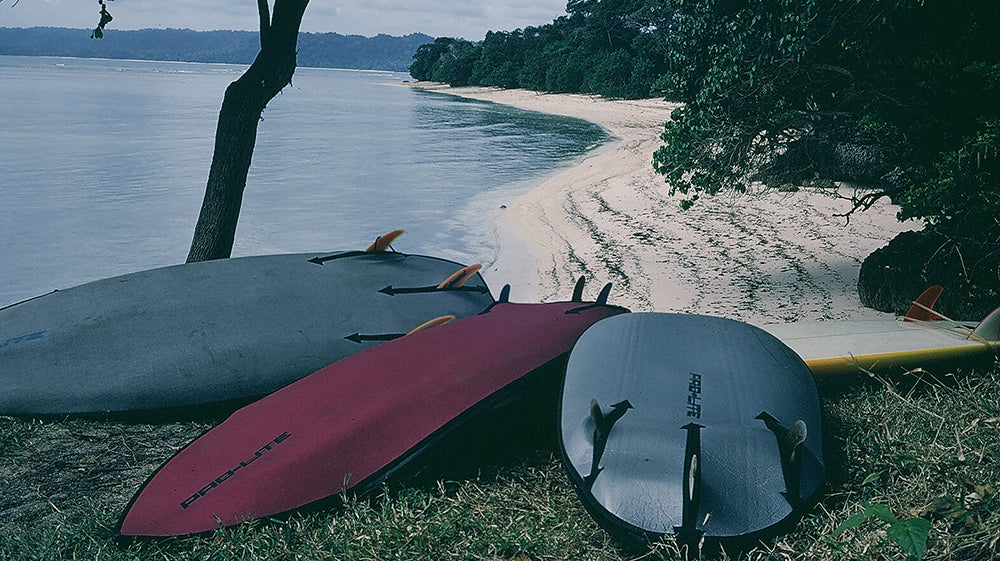 vintage pro-lite surfboard bags on the beach