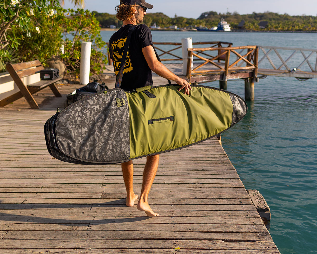 Ben Weiland on dock with prolite session surfboard day bag