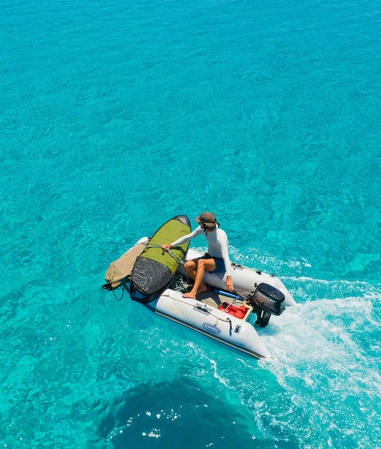 Surfer on boat with prolite surfboard day bag.