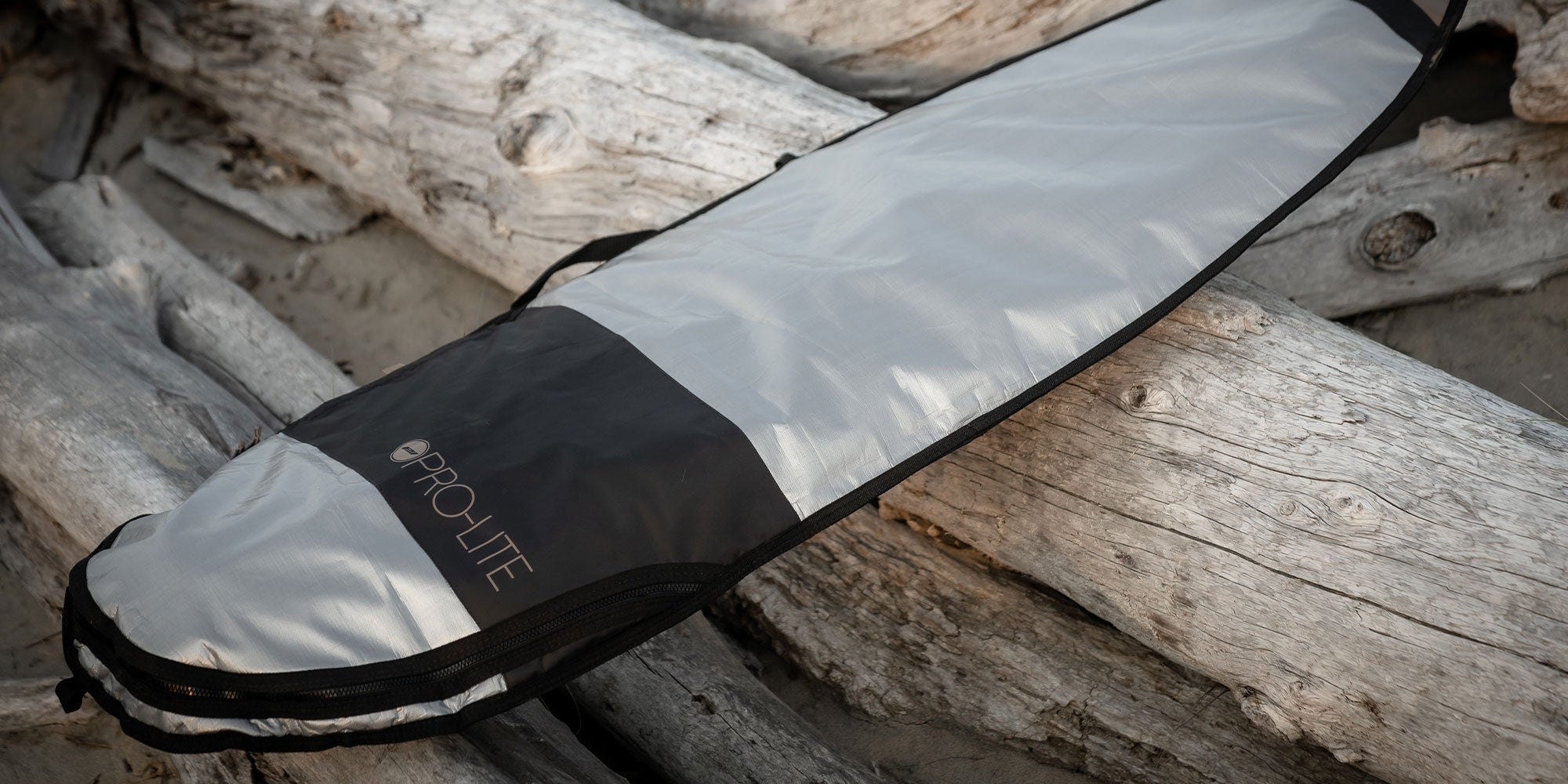 pro-lite resession surfboard day bag at beach, how to choose a surfboard bag