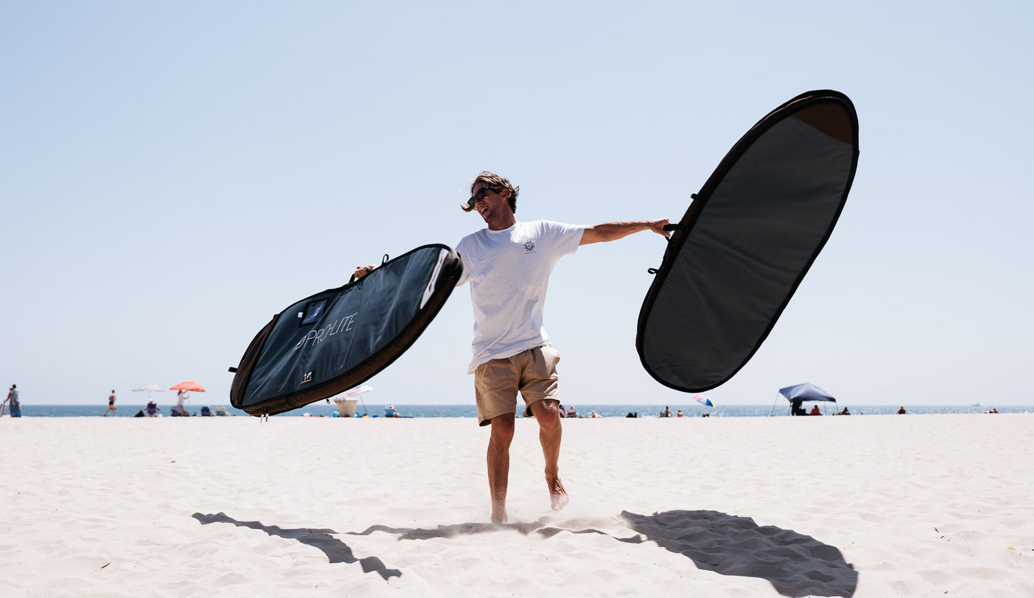 Matt Wilkinson holds 2 parts of the prolite convertible travel bag.