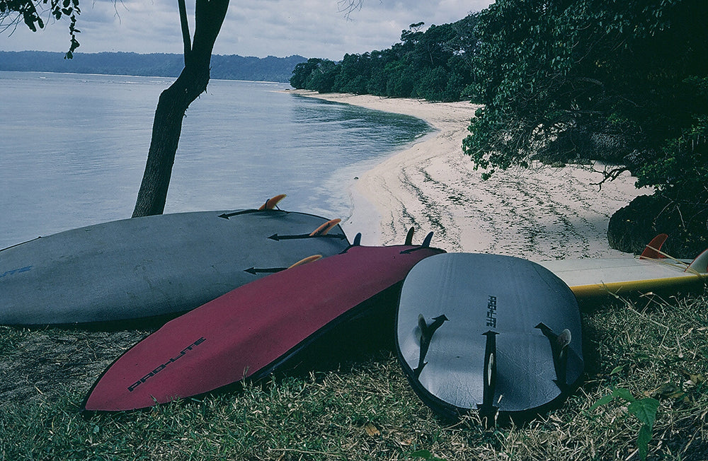 vintage pro-lite surfboard bags on the beach