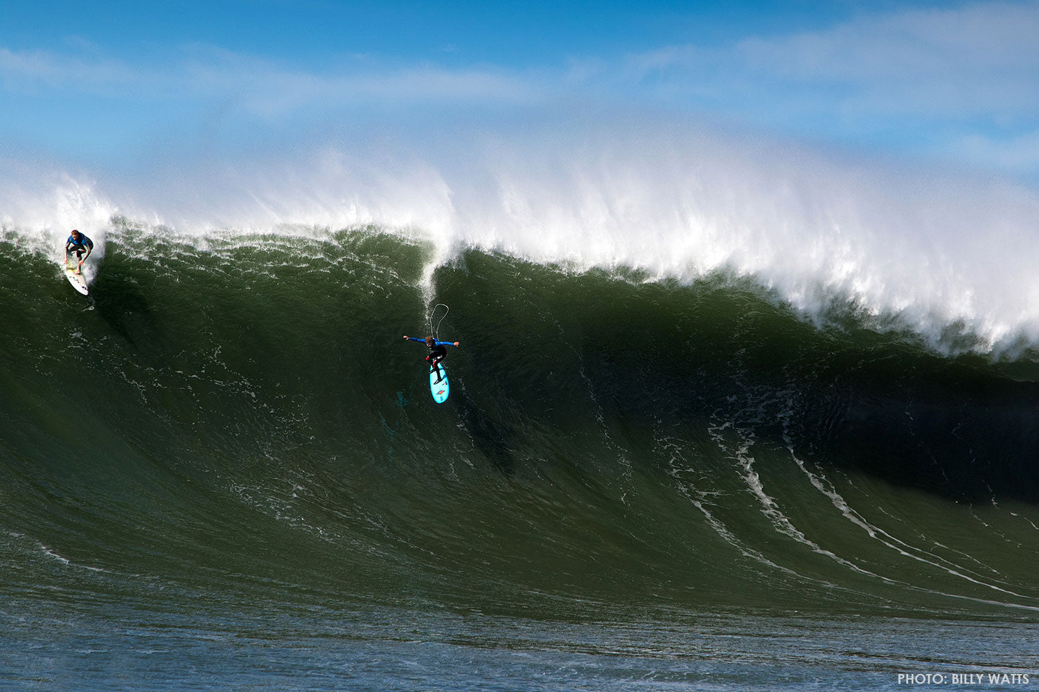 Matt Becker airdrops into a large wave surfing maverick’s. 