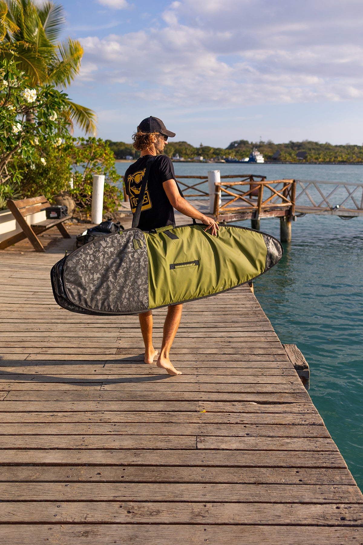 Ben Weiland on dock with prolite session surfboard day bag