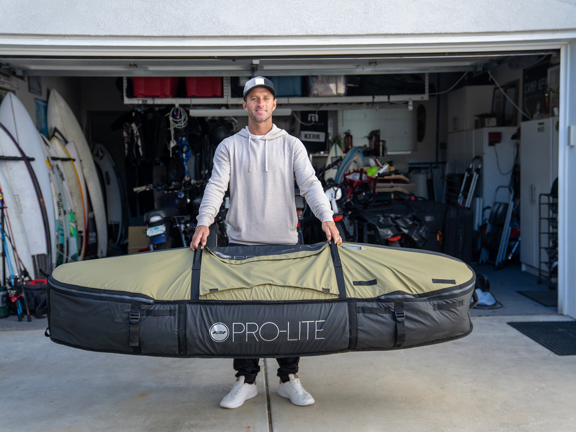 Josh Kerr holding the Pro-Lite finless coffin deep surfboard travel bag.