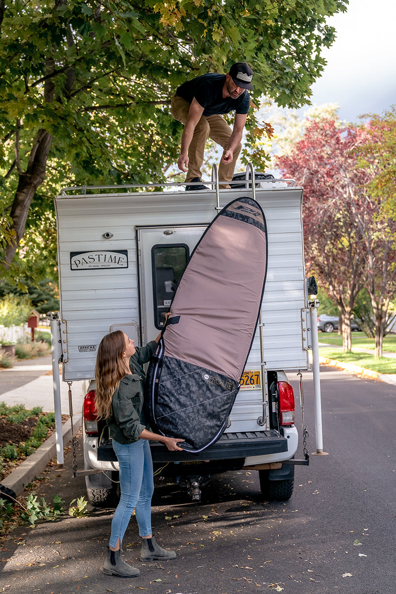 Loading session fish day bag on vehicle