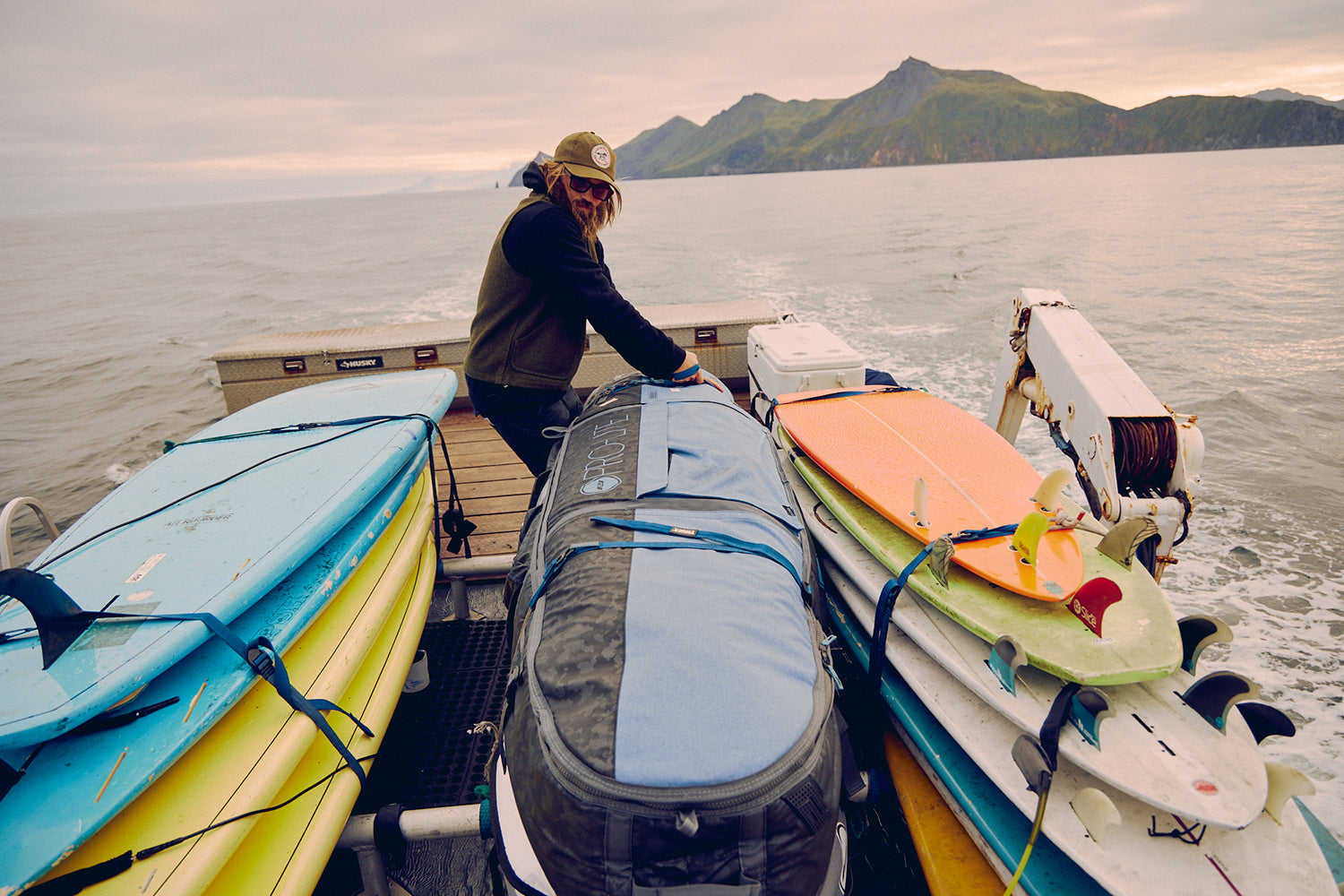 Armored coffin surfboard travel bag on boat alaska