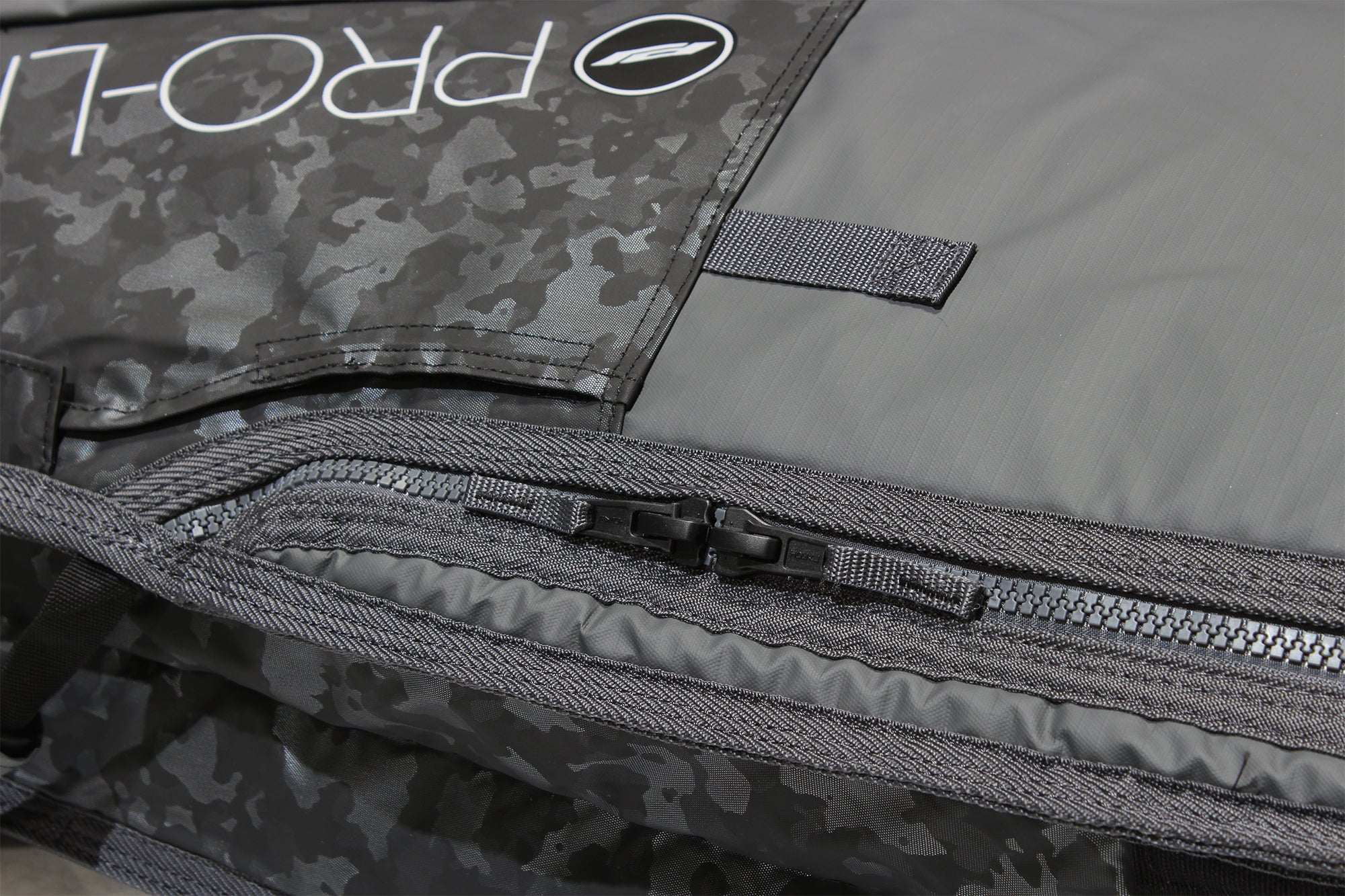 Close up of smuggler surf travel bag molded zippers