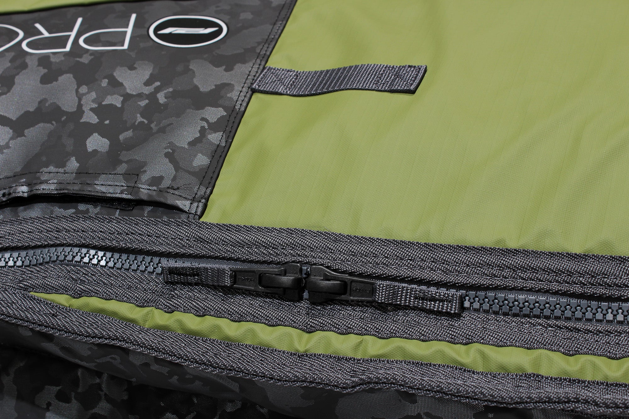 Close up of molded zipper on smuggler fish travel bag.