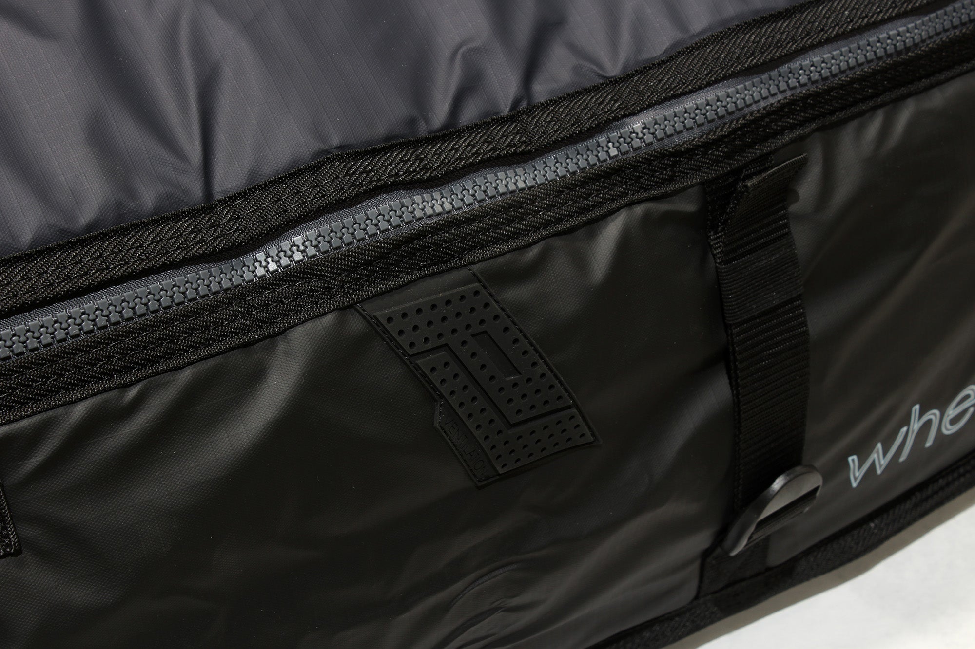 Cross ventilation points keep boards cool in pro-lite wheeled coffin surfboard travel bag.