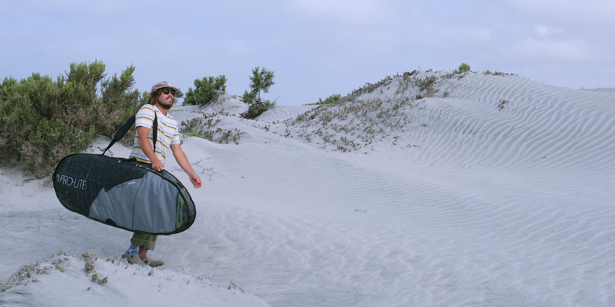 timmy reyes walking with pro-lite rhino surf travel bag