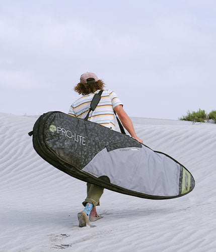 timmy reyes walking with rhino surf travel bag