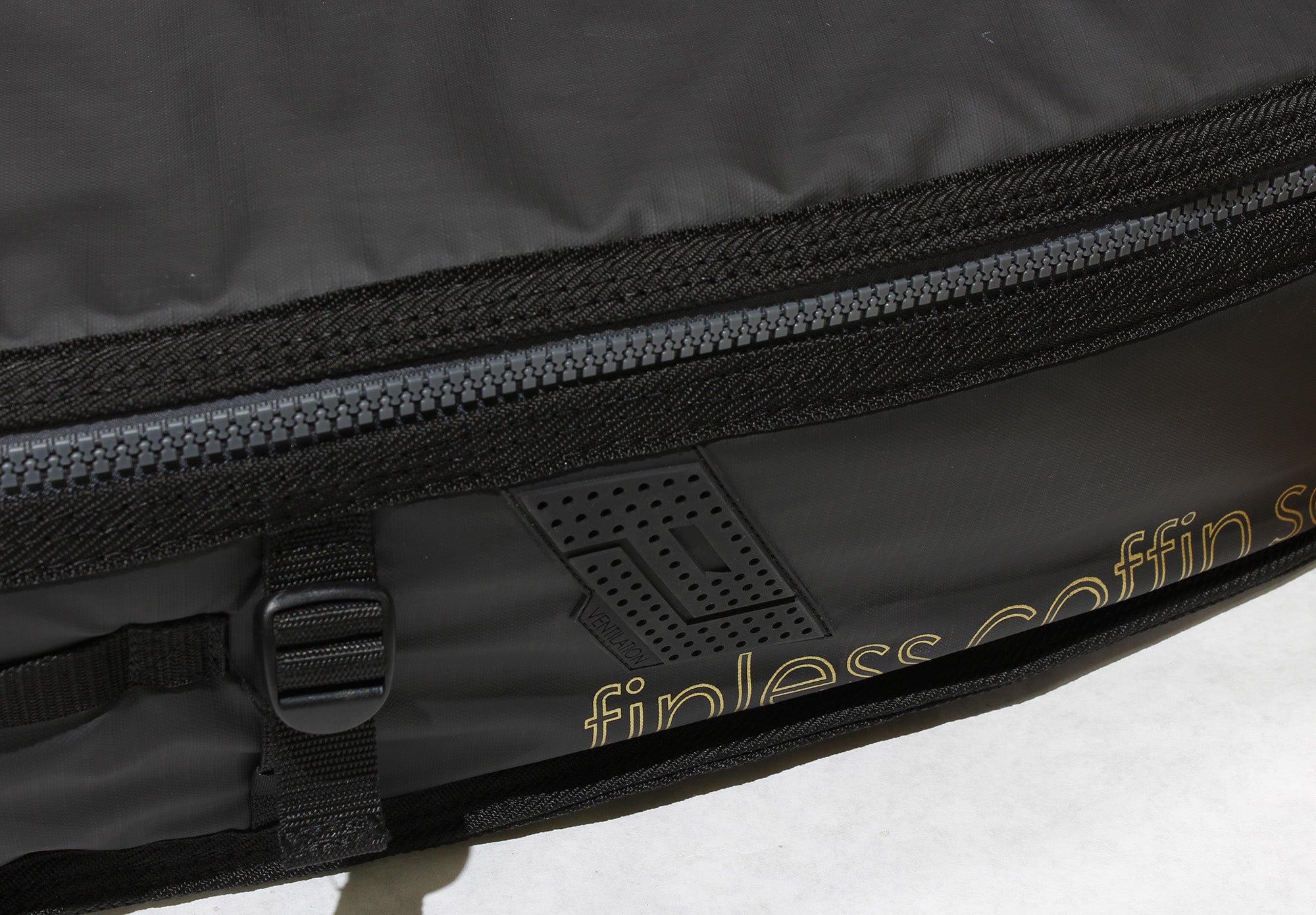 Pro-Lite finless coffin surfboard travel bag cross ventilation points.