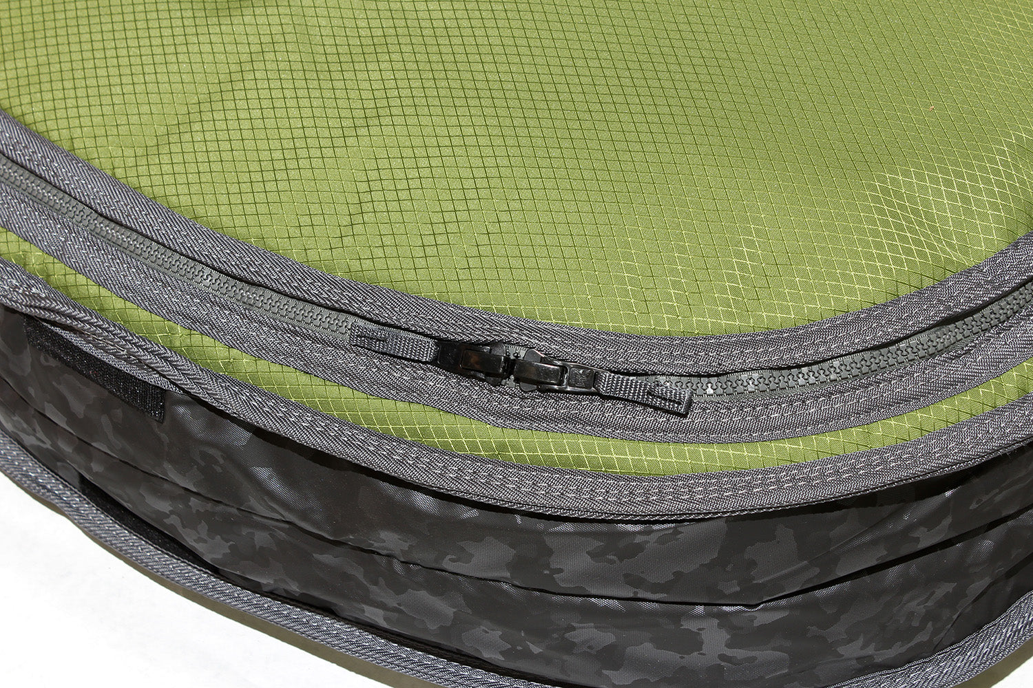 Close up of molded zipper on smuggler fish travel bag.