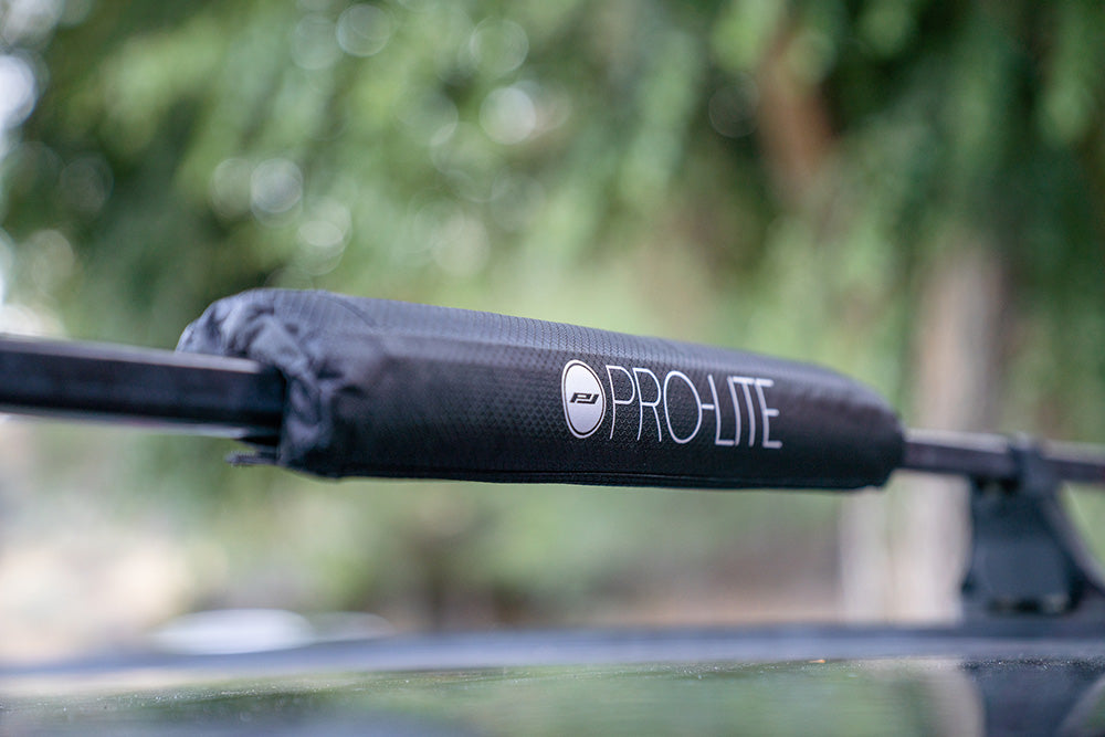 close up of round bar roof rack pad on vehicle