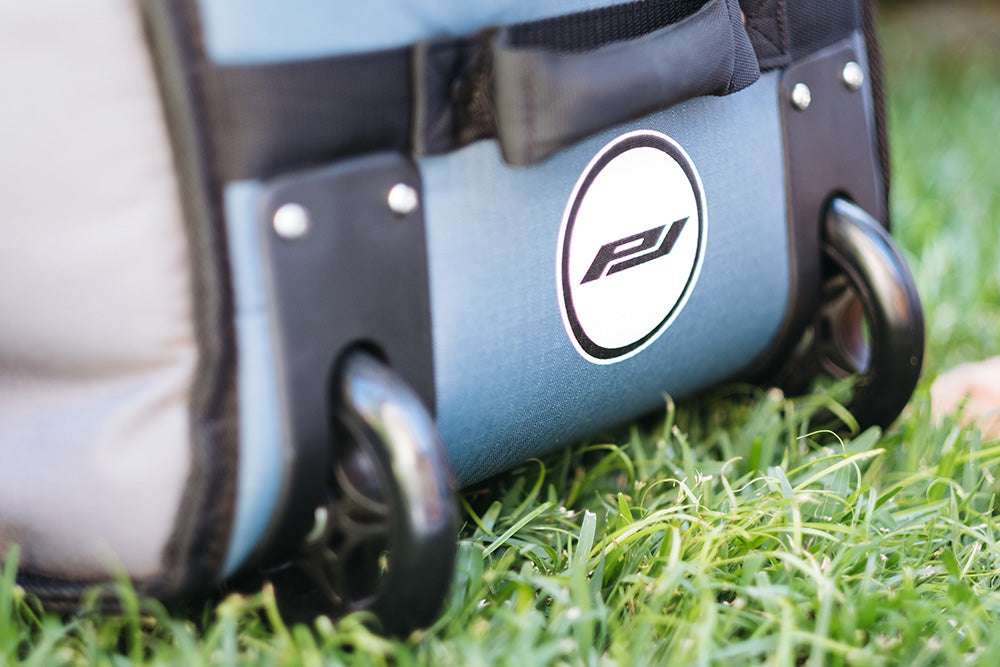 Wheel housing system on the wheeled coffin travel bag.